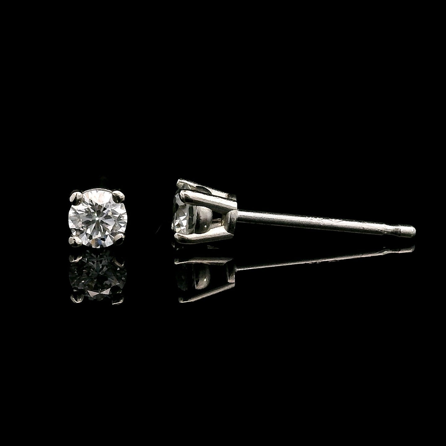 14K White gold stud earrings set with round brilliant diamonds. Item J39014 - ABC Jewelry Co. 