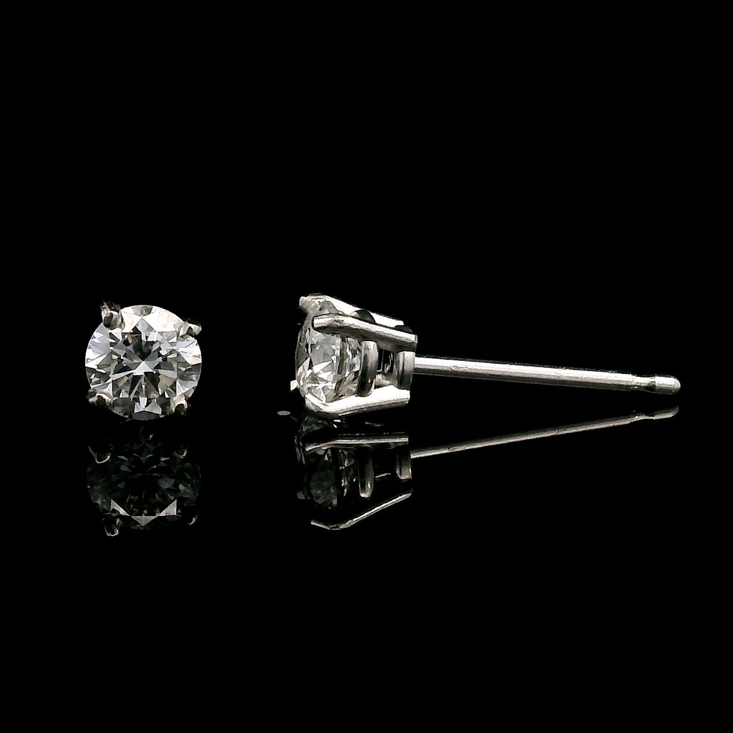14K White gold stud earrings set with round brilliant diamonds. Item J39014 - ABC Jewelry Co. 