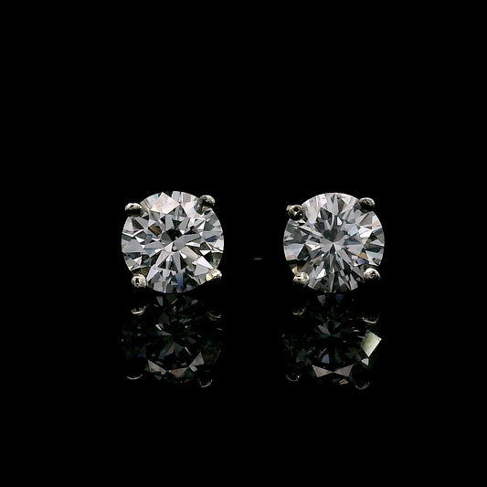 14K White gold stud earrings set with round brilliant diamonds. Item J39016 - ABC Jewelry Co. 