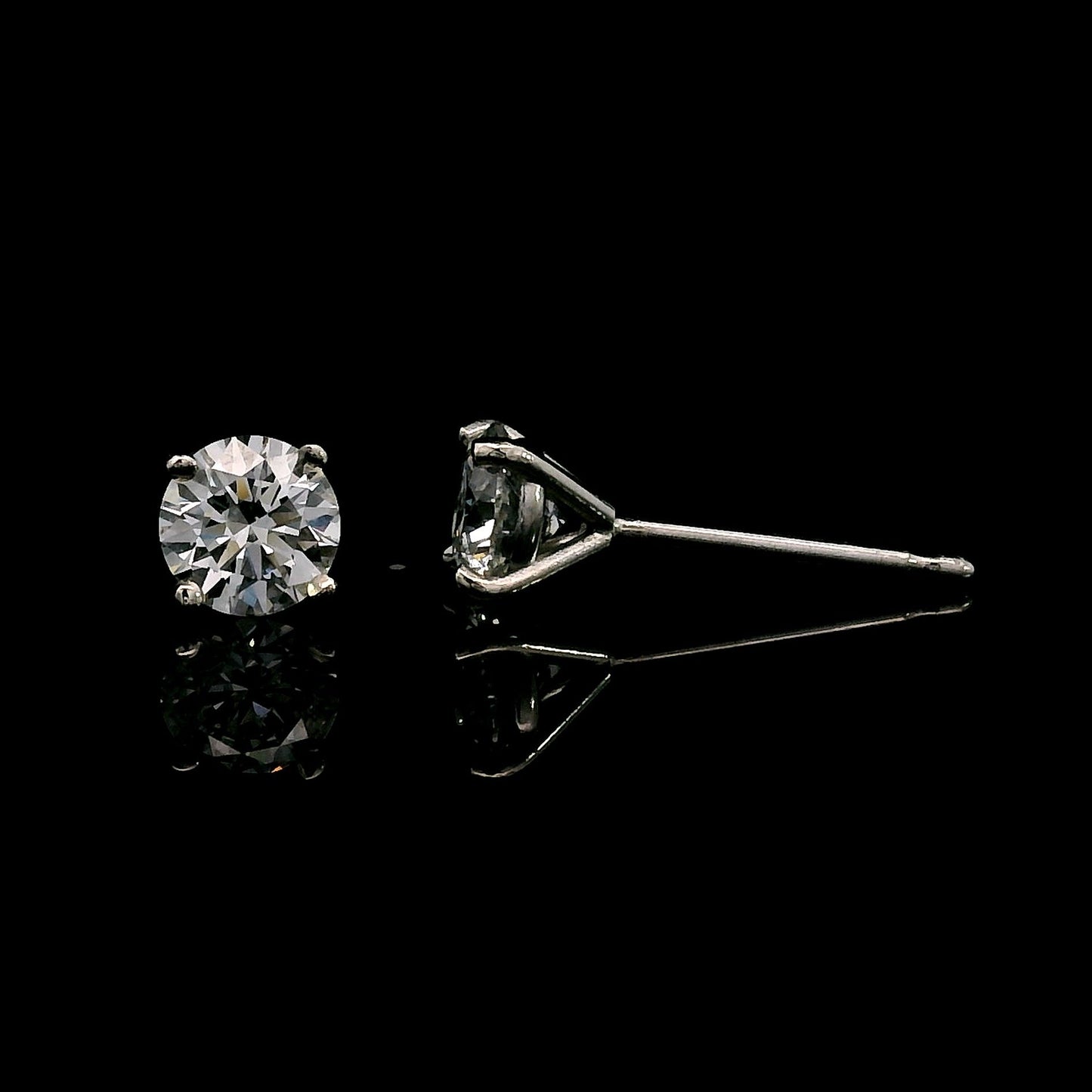 14K White gold stud earrings set with round brilliant diamonds. Item J39014 - ABC Jewelry Co. 