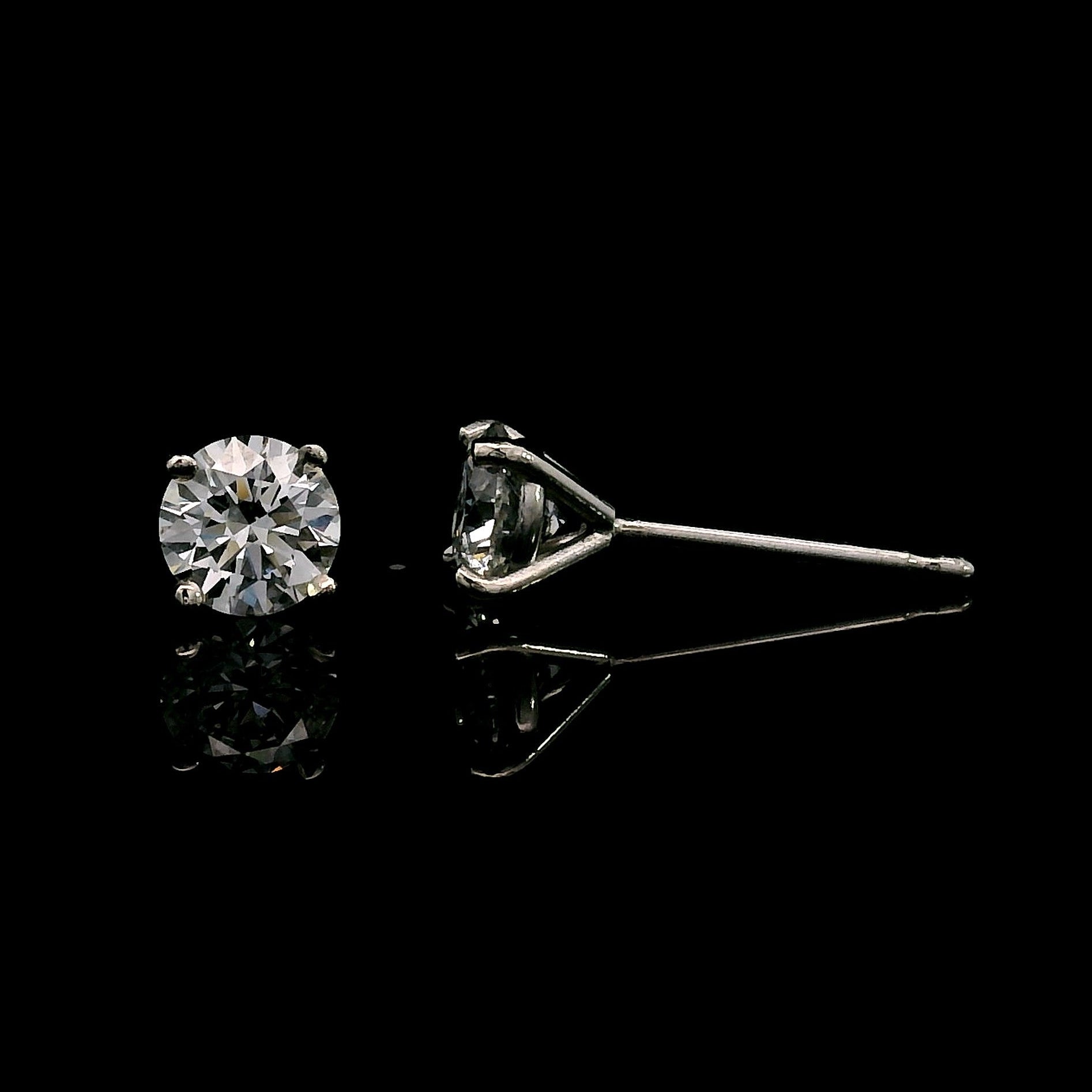 14K White gold stud earrings set with round brilliant diamonds. Item J39014 - ABC Jewelry Co. 