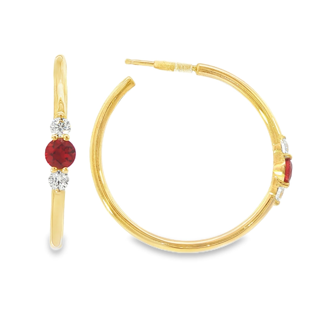 14K Yellow gold hoop earrings, each set with a round ruby flanked by two round diamonds. Item - J39018 - ABC Jewelry Co. 