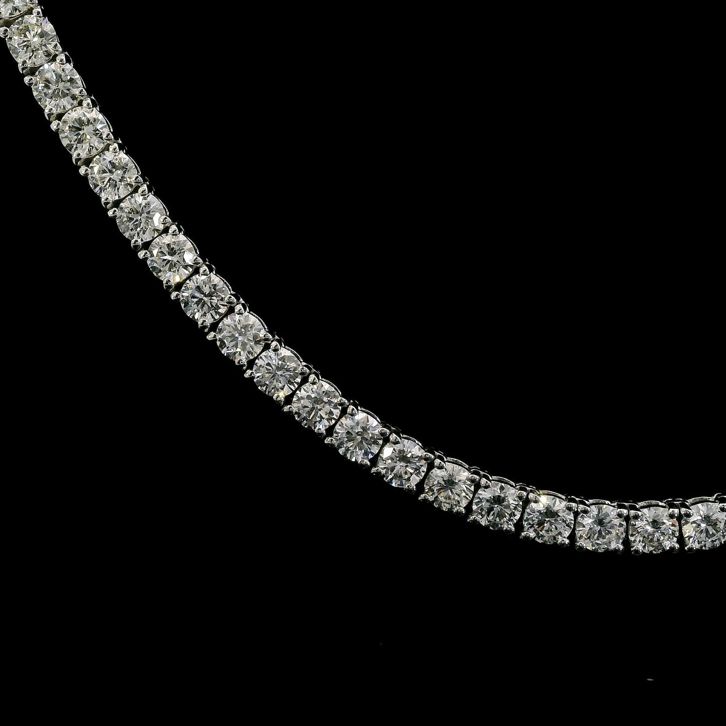 14K White gold tennis necklace set with round brilliant diamonds. Item J39087 - ABC Jewelry Co.