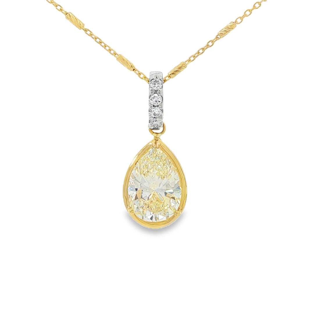 18K Two-tone pendant set with a pear shaped yellow diamond. Item #J39168 - ABC Jewelry Co. 