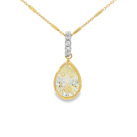 18K Two-tone pendant set with a pear shaped yellow diamond. Item #J39168 - ABC Jewelry Co. 