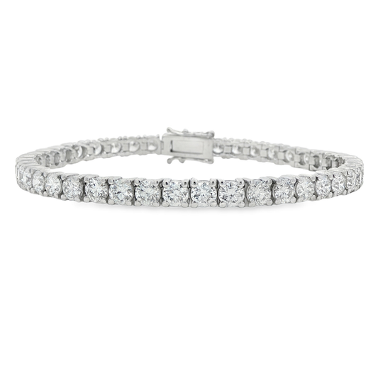 14K White gold tennis bracelet set with round brilliant diamonds. Item J38985 - ABC Jewelry Co