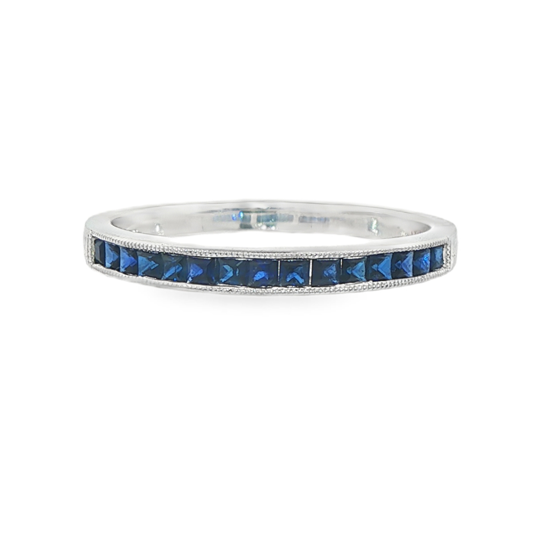 14K White gold band channel set with blue sapphires. Item J32315 - ABC Jewelry Co. 
