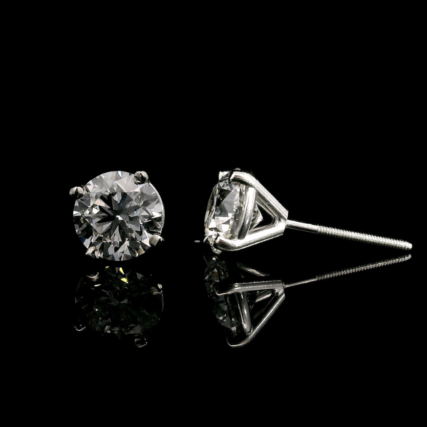 14K White gold studs set with round brilliant diamonds. Item J38705 - ABC Jewelry Co. 
