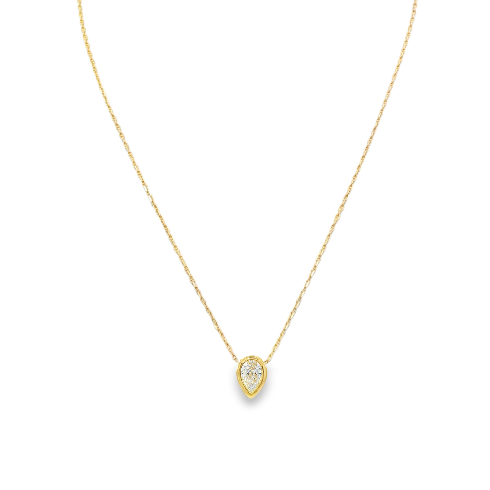 14K Yellow gold necklace bezel set with a pear shape diamond. Item J37647 - ABC Jewelry Co. 
