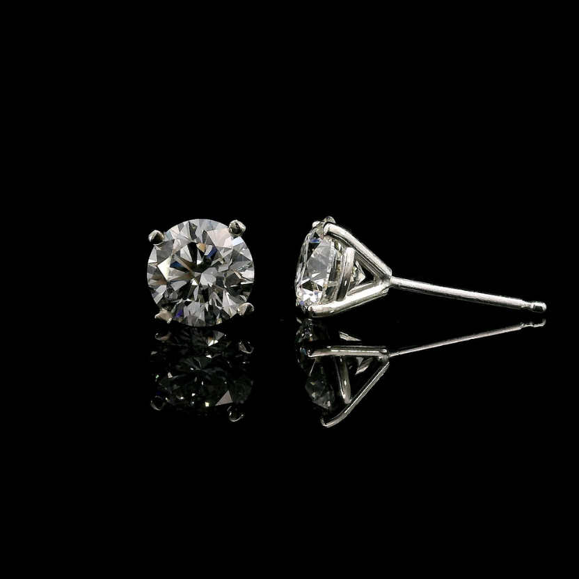 14K White gold stud earrings set with round brilliant diamonds. Item J37810 - ABC Jewelry Co.