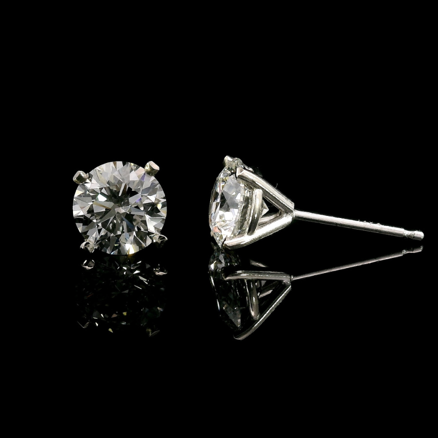 14K White gold stud earrings set with round brilliant diamonds. Item J37811 - ABC Jewelry Co.