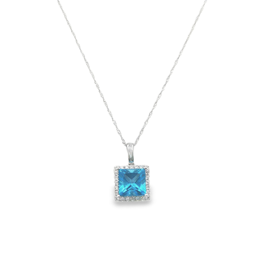 14K White gold pendant set with blue topaz and a diamond halo. Item J38757 - ABC Jewelry Co.