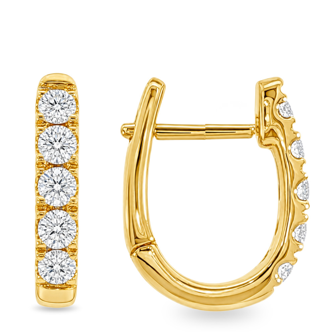 Yellow gold oval huggie earrings with 5 round diamonds each shown on a clean white background 