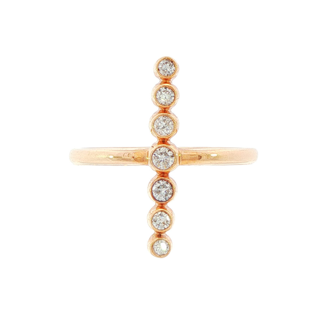 14K Rose gold ring with vertical line of bezel set round brilliant diamonds. Item J31309 - ABC Jewelry Co