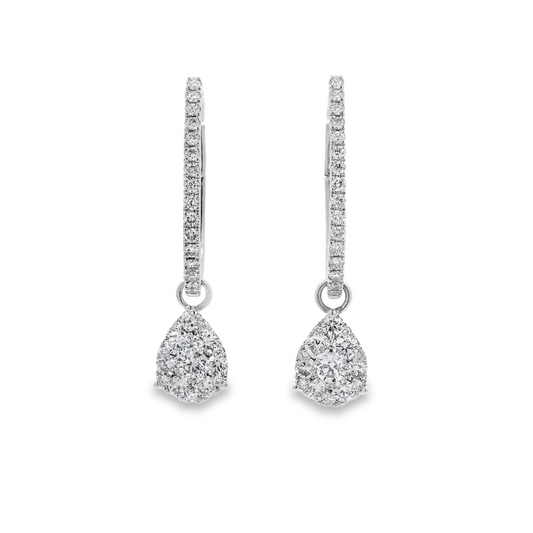 18K White gold earring jackets featuring clusters of diamonds, shown on white gold diamond hoop earrings. Item J35758 - ABC Jewelry Co