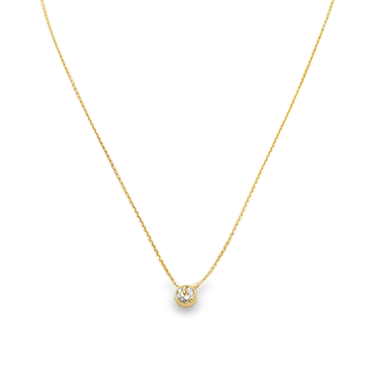 14K Yellow gold solitaire necklace with a bezel set round brilliant diamond. Item J36073 - ABC Jewelry Co. 