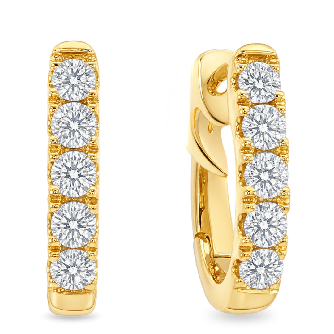 Yellow gold oval huggie earrings with 5 round diamonds each shown on a clean white background 