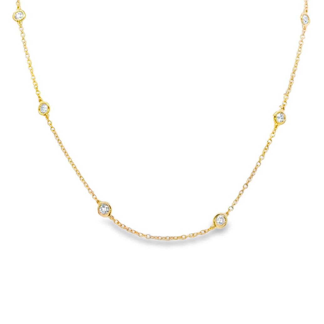 18K Yellow gold necklace with bezel set round brilliant diamonds set along the chain. Item J38856 - ABC Jewelry Co. 