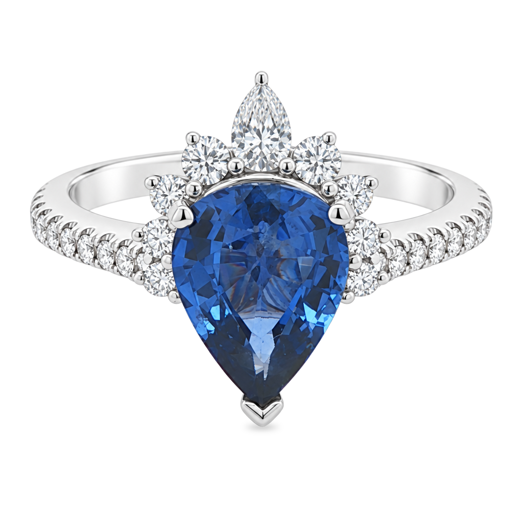 White gold ring set with a pear shape blue sapphire with a graduated half halo of diamonds and diamonds on the band. Set on a clean white background.