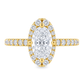Yellow gold ring with round diamonds on the band and a diamond halo, set with an elongated oval diamond set on a white background.