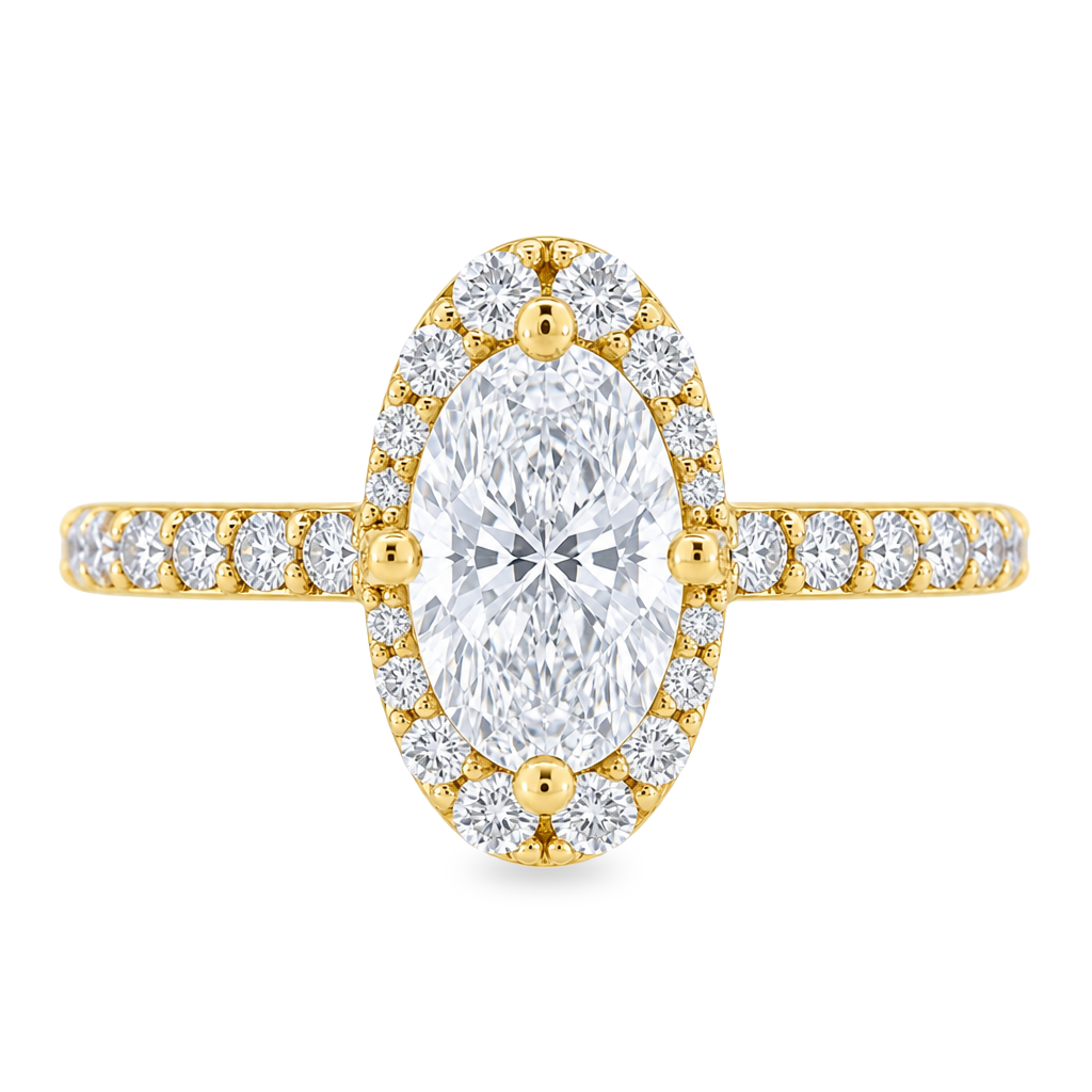 Yellow gold ring with round diamonds on the band and a diamond halo, set with an elongated oval diamond set on a white background.