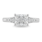 A radiant cut diamond engagement ring in a white gold band with pavé diamonds on either side, shown on a clean white background.
