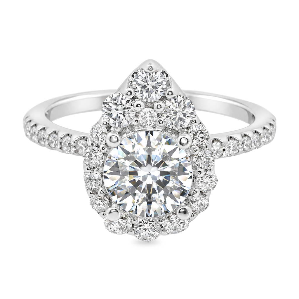 White gold ring set with a round diamond surrounded by a pear shape halo of graduated diamonds with diamonds set along the band. Shown on a clean white background.