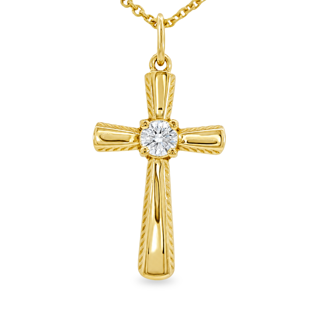 Yellow gold cross with a round diamond prong set in the center. Set on plain white background.