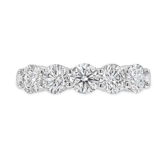 White gold band with 5 round brilliant diamonds in a shared prong setting 