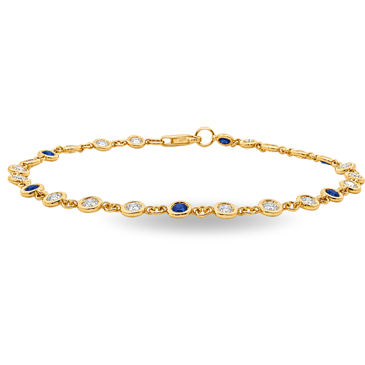 A gold link bracelet featuring alternating round bezel-set diamonds and deep blue sapphires, with a lobster clasp closure, shown on a plain white background.