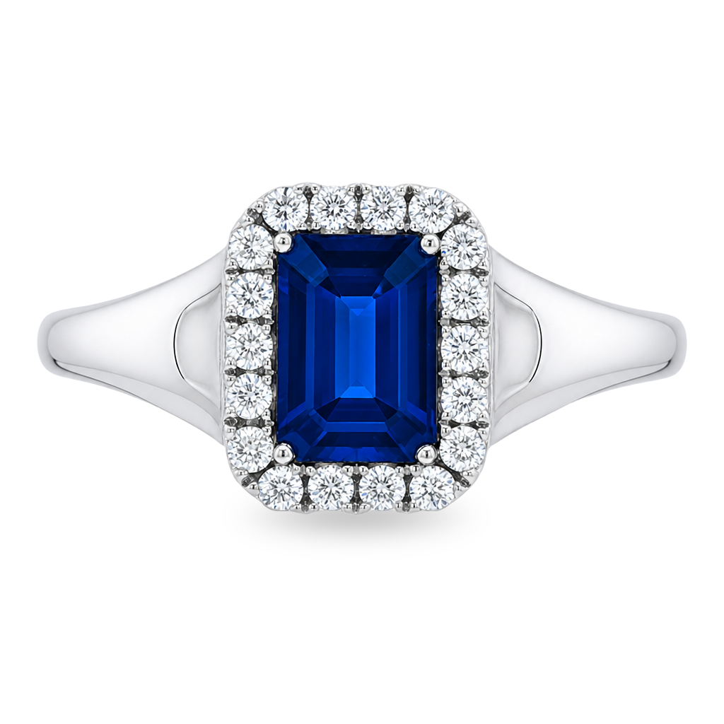 A white gold ring featuring a rectangular emerald-cut blue sapphire center stone surrounded by a halo of small round-cut diamonds. Set on a clean white background.
