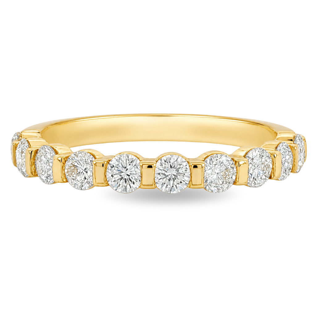 A yellow gold band featuring round brilliant-cut diamonds set in a continuous band, shown against a plain white background.