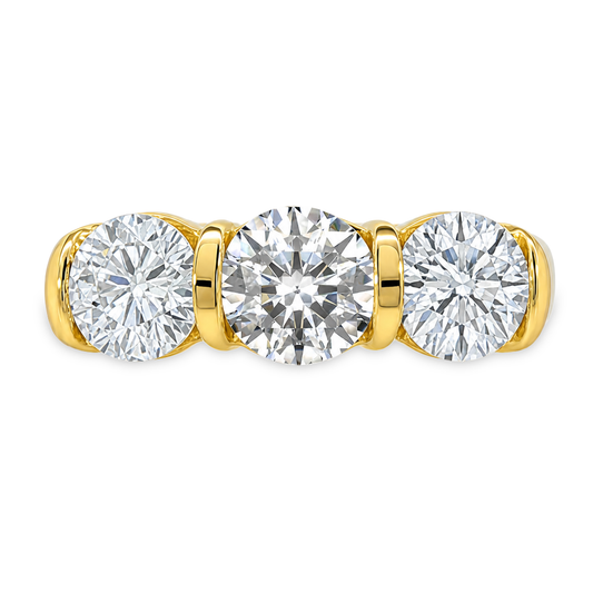 Yellow gold ring with three round diamonds, set on a white background 