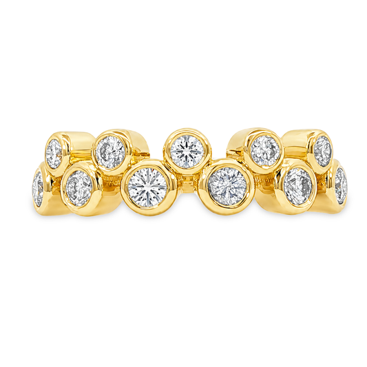 Yellow gold band with a double row of spaced bezel set diamonds, set on a clean white background.