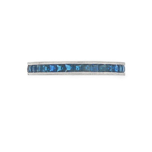 14K White gold eternity band set with princess cut blue sapphires. Item J37260 - ABC Jewelry Co. 