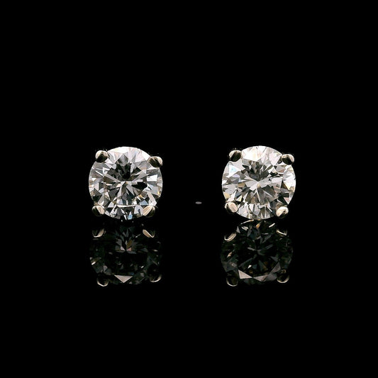14K White gold stud earrings set with round brilliant diamonds. Item J37365 - ABC Jewelry Co.