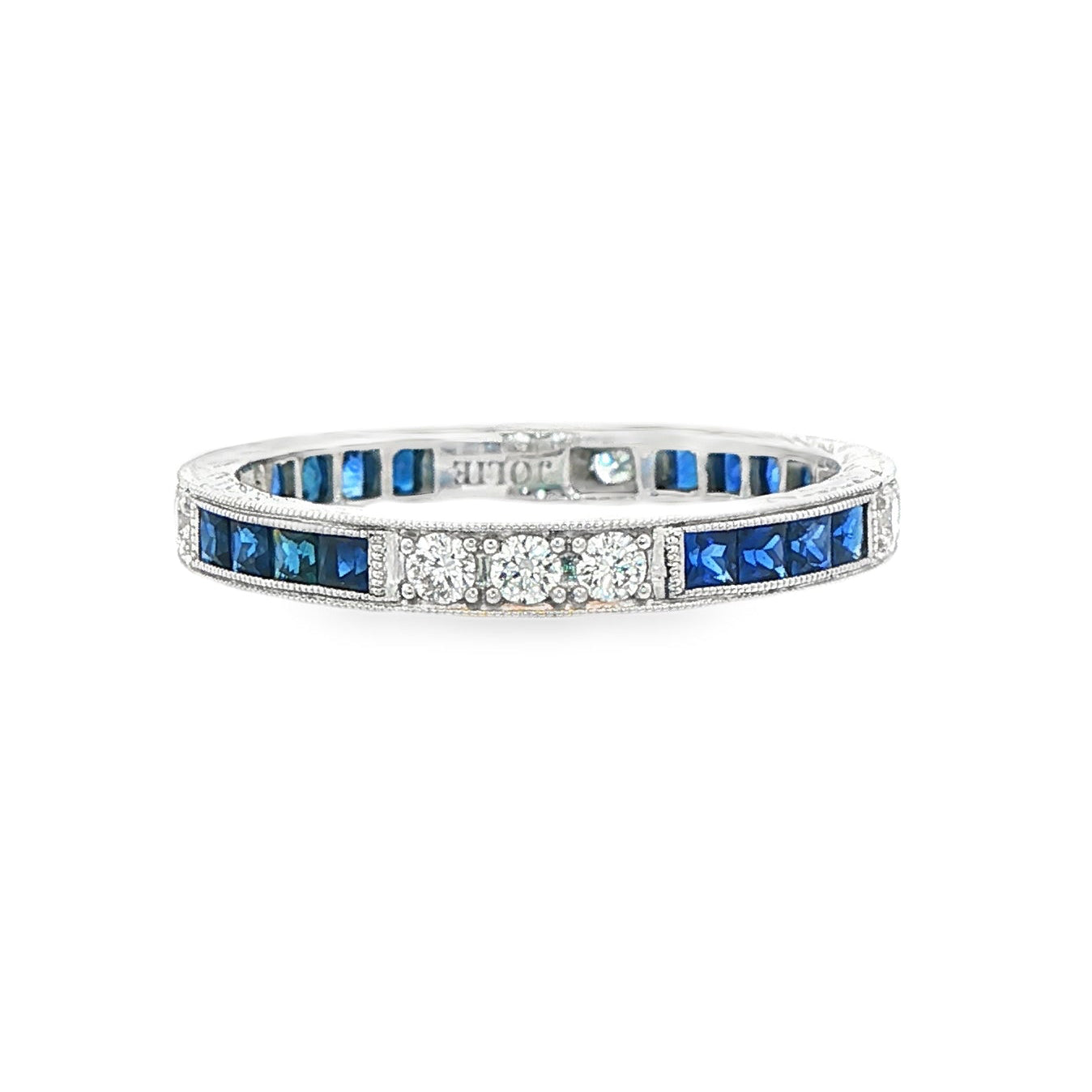 18K White gold eternity band set with princess set blue sapphires and round brilliant diamonds. Item J37387 - ABC Jewelry Co. 