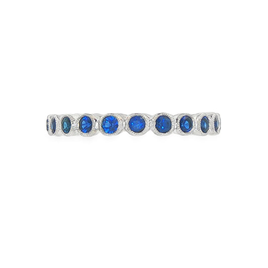 14K White gold eternity band bezel set with round blue sapphires. Item J37389 - ABC Jewelry Co. 