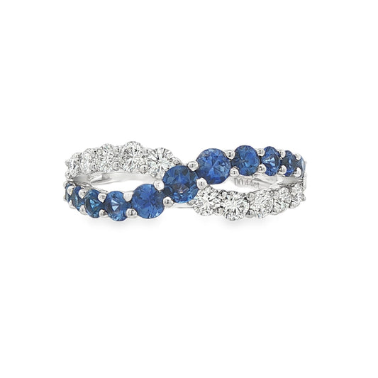 18K White gold cross-over ring set with blue sapphires and round brilliant diamonds. Item J37605 - ABC Jewelry Co. 