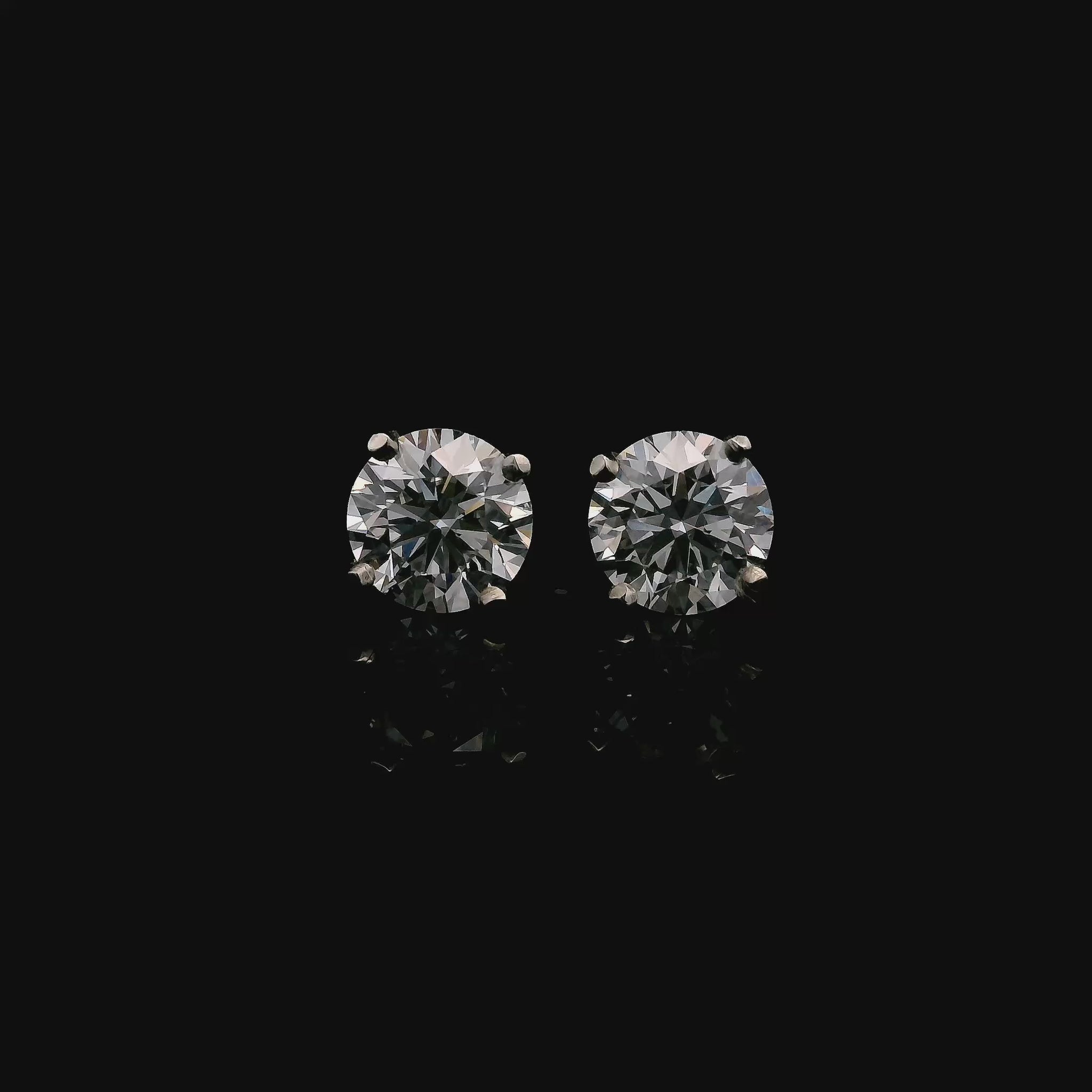 14K White gold stud earrings set with round brilliant diamonds. Item J37948 - ABC Jewelry Co. 