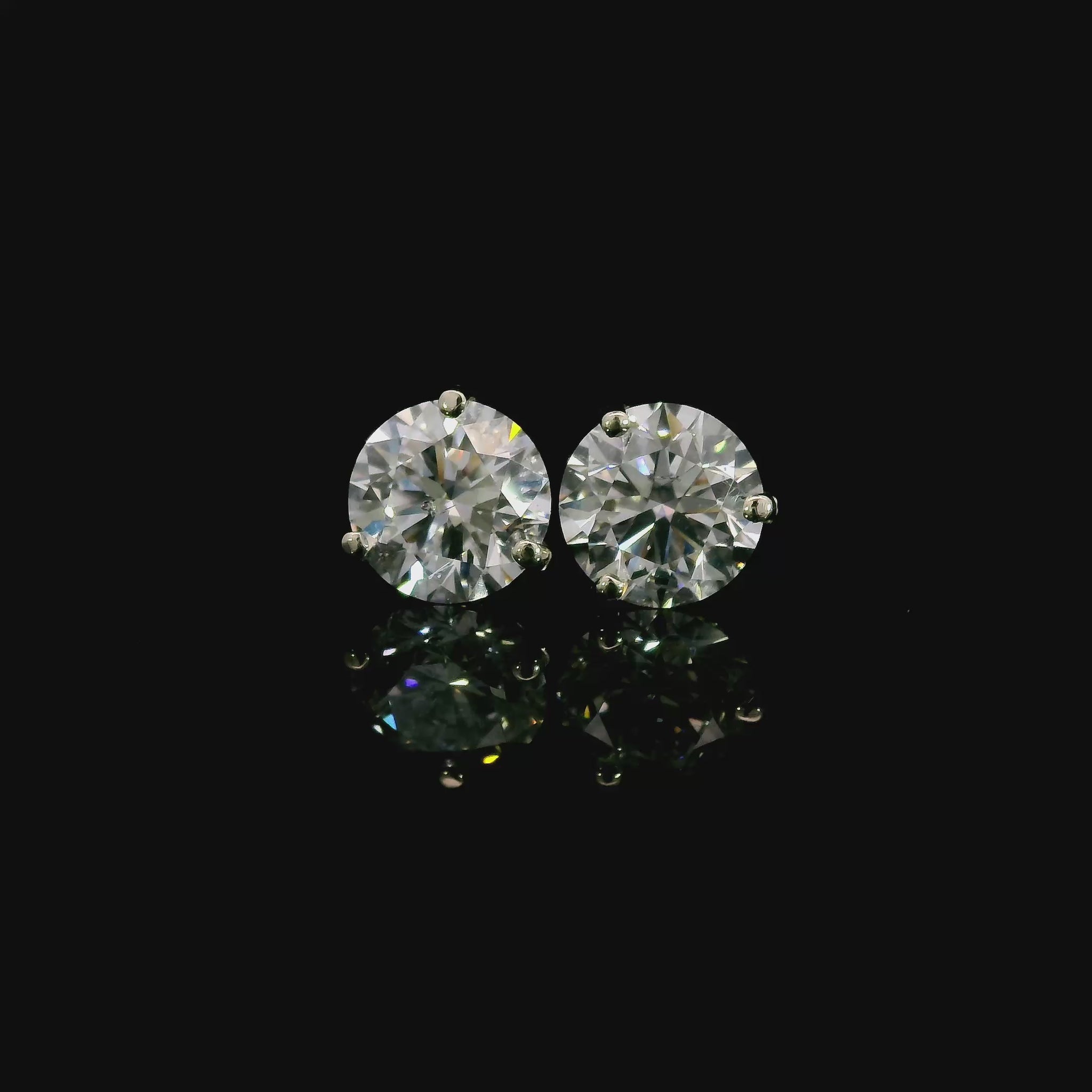 14K White gold studs set with round brilliant diamonds. Item J37908 - ABC Jewelry Co. 