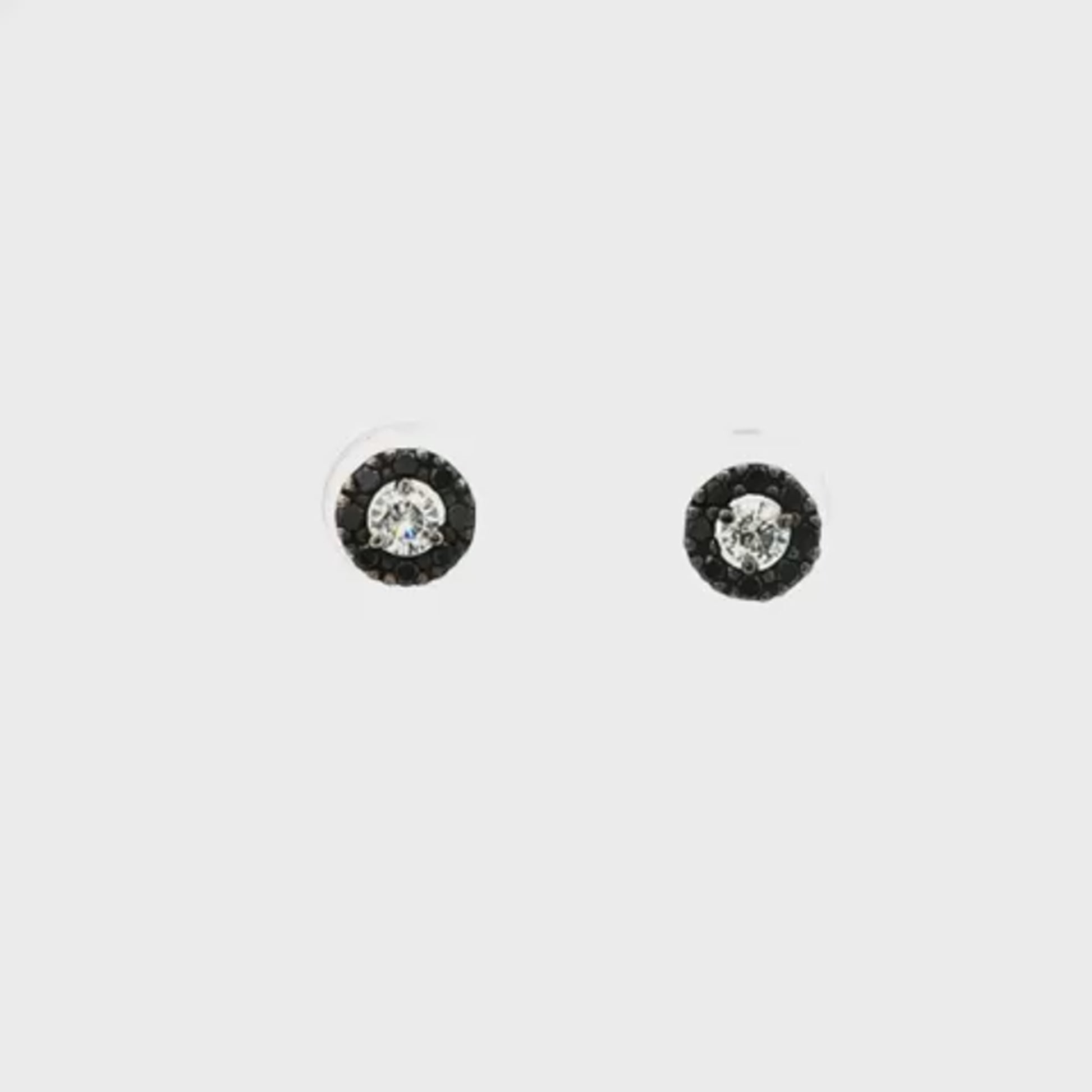 14K White gold earring with round brilliant diamond center stone surrounded by a black diamond halo. Item 19175 - ABC Jewelry Co.