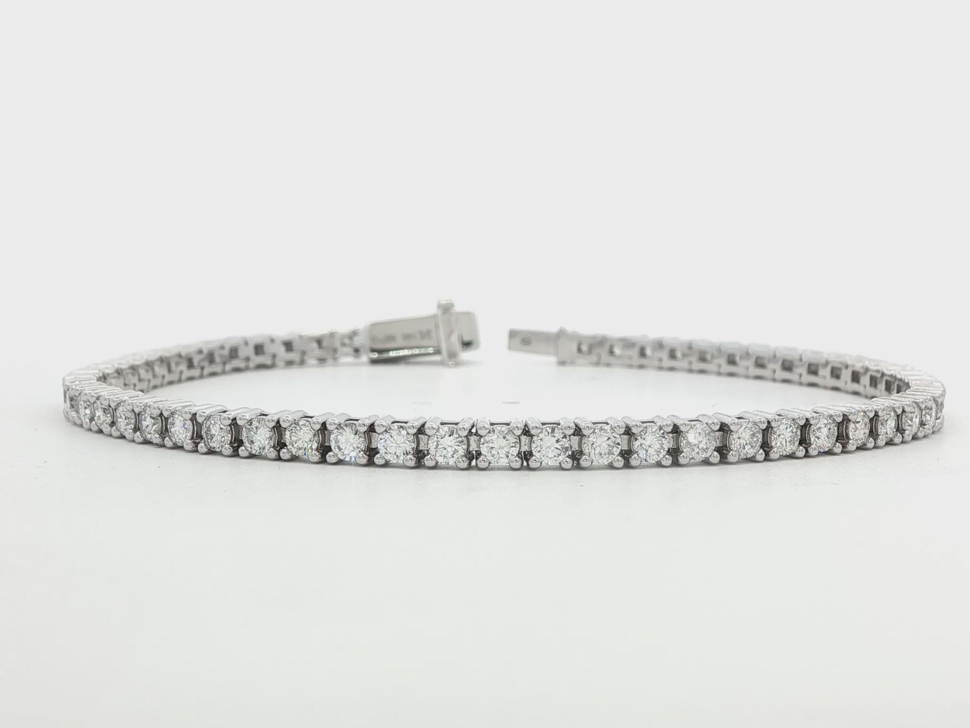 14K white gold tennis bracelet set with round brilliant diamonds. Item J38668 - ABC Jewelry Co.