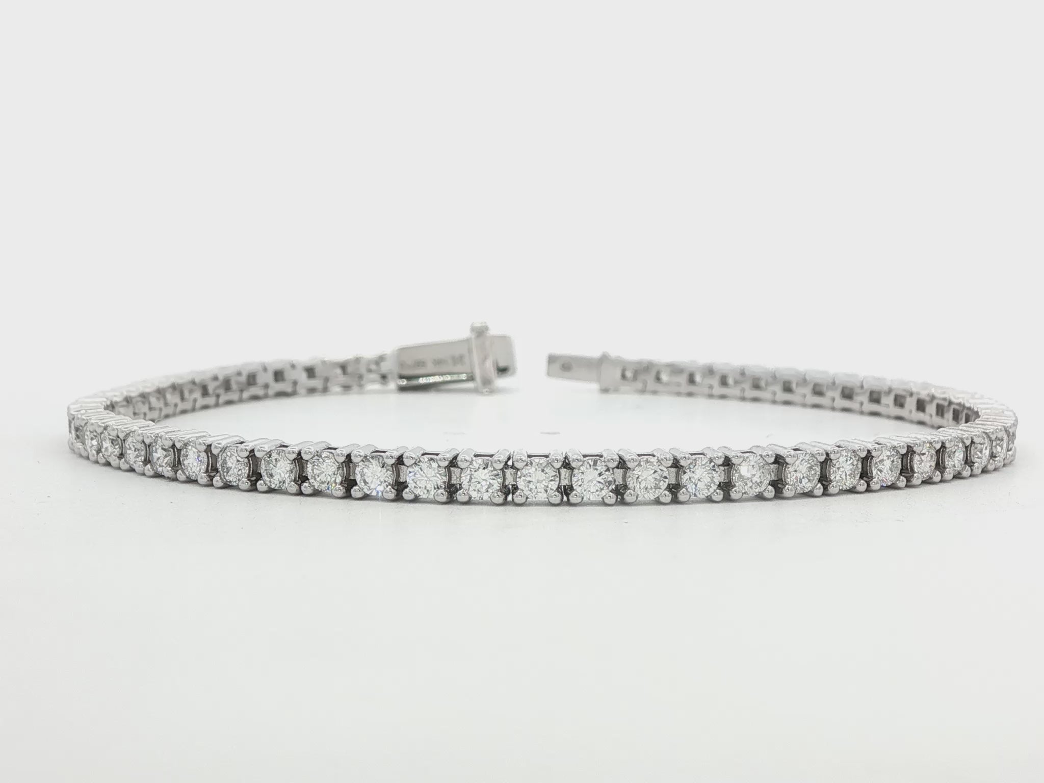 14K white gold tennis bracelet set with round brilliant diamonds. Item J38668 - ABC Jewelry Co.