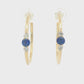 14K Yellow gold hoop earrings, each set with a round blue sapphire flanked by two round diamonds. Item - J39003 - ABC Jewelry Co. 