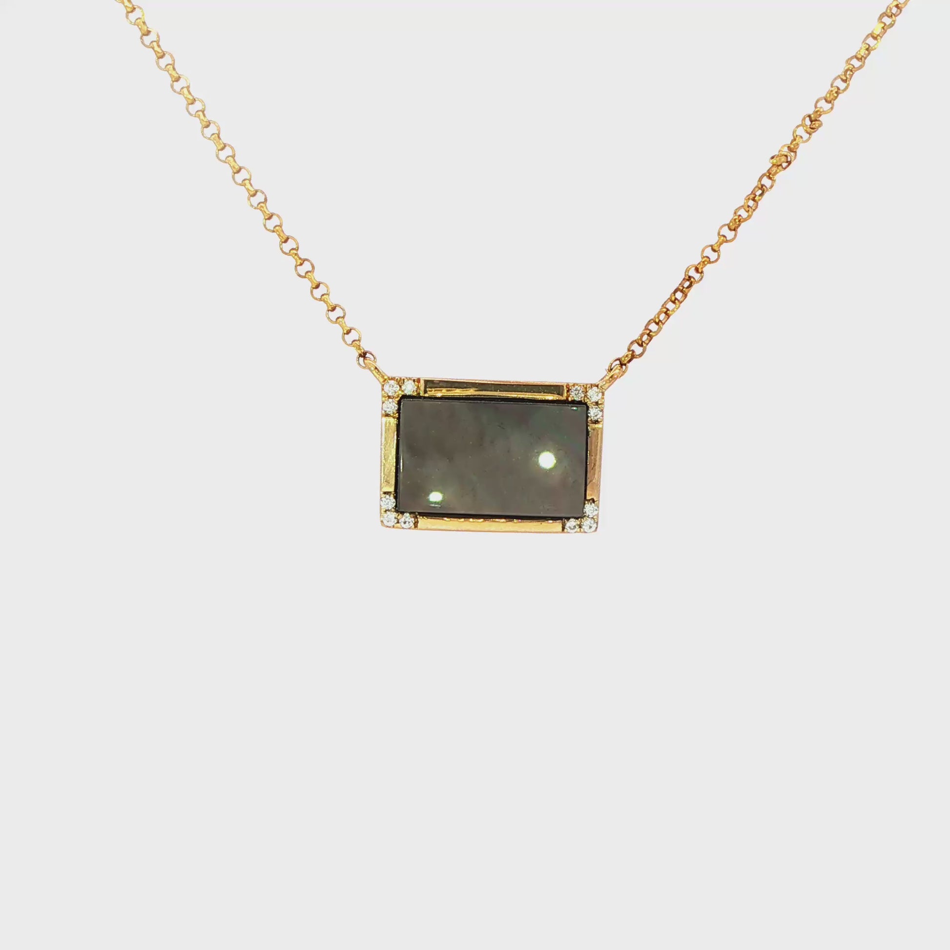 14K Yellow gold pendant necklace set with black mother of pearl. Item J31812 - ABC Jewelry Co
