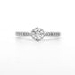 18K White gold ring featuring a round brilliant diamond center stone and accented with diamonds down the shank. Item J34776 - ABC Jewelry Co.