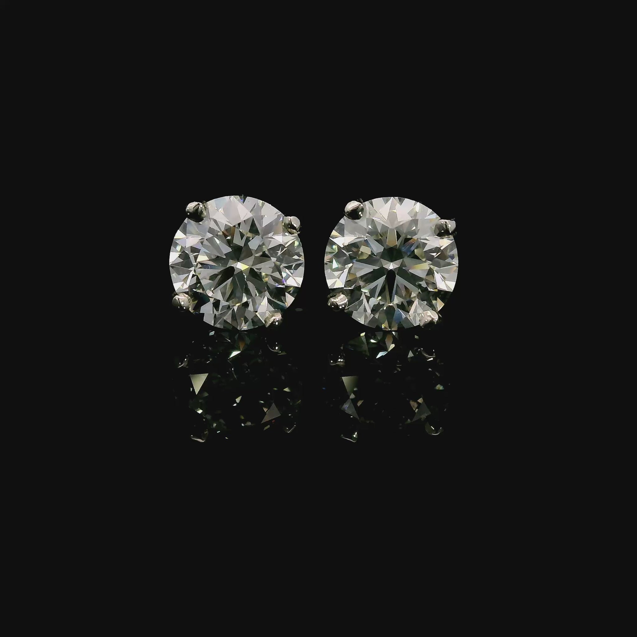 14K White gold studs set with round brilliant diamonds. Item J37909 - ABC Jewelry Co. 