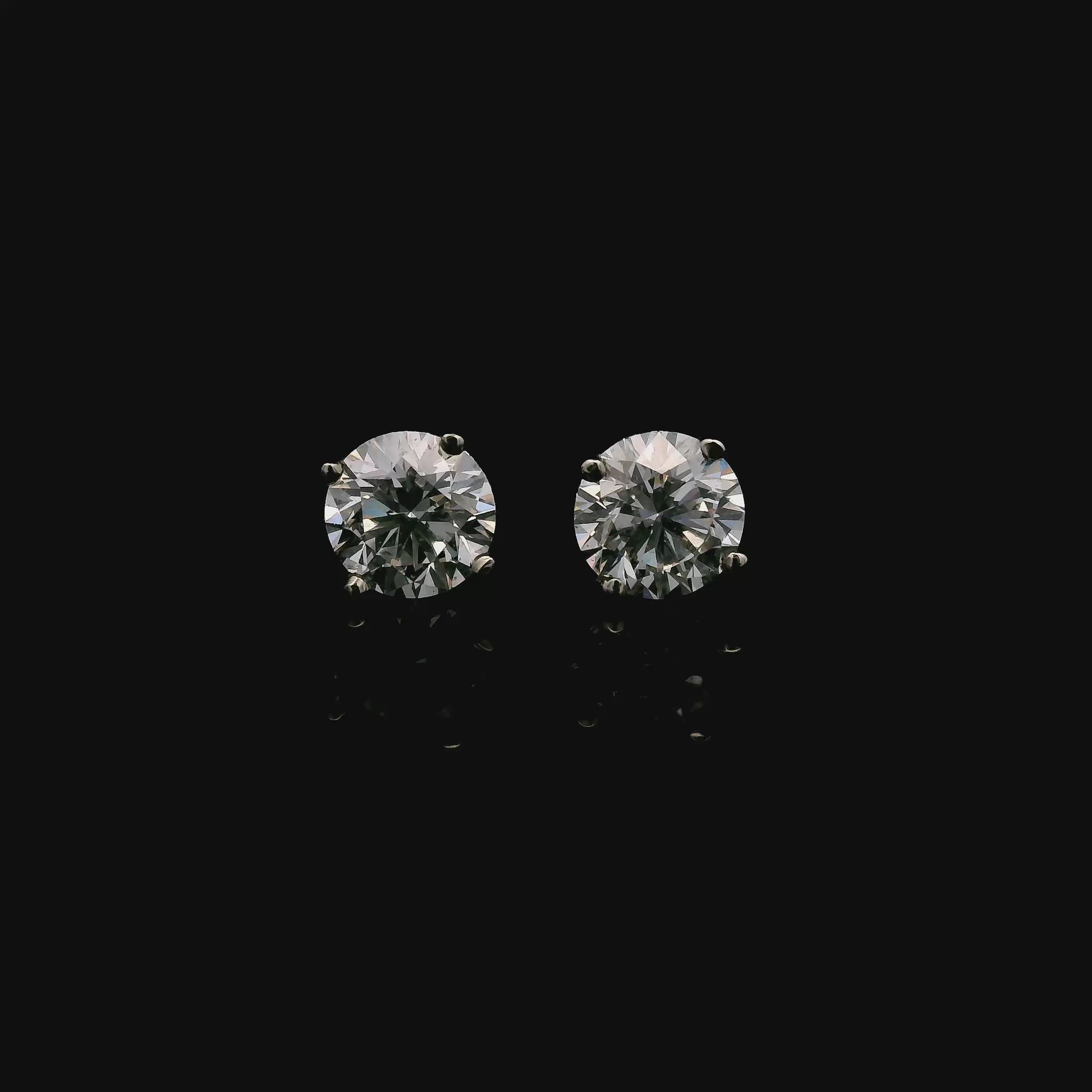 14K White gold diamond stud earrings. Item J38131 - ABC Jewelry Co. 