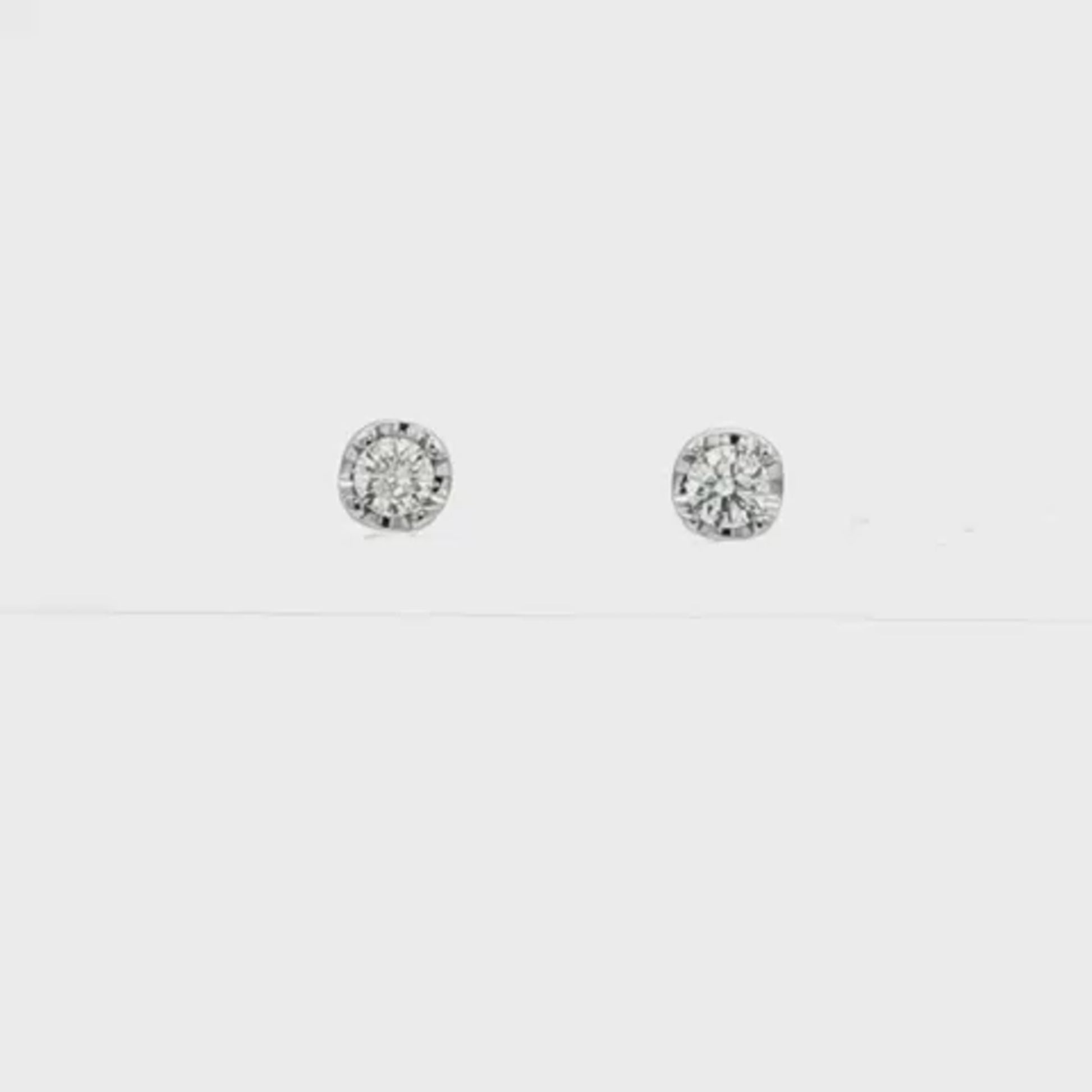 18K White gold stud earrings set with round brilliant diamonds. Item J37480 - ABC Jewelry Co.